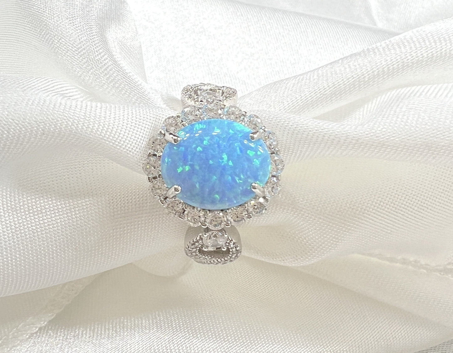 *PRE-ORDER - 925 Sterling Silver Infinity Oval Cut Lab-Grown Blue Fire Opal & Diamond CZ
