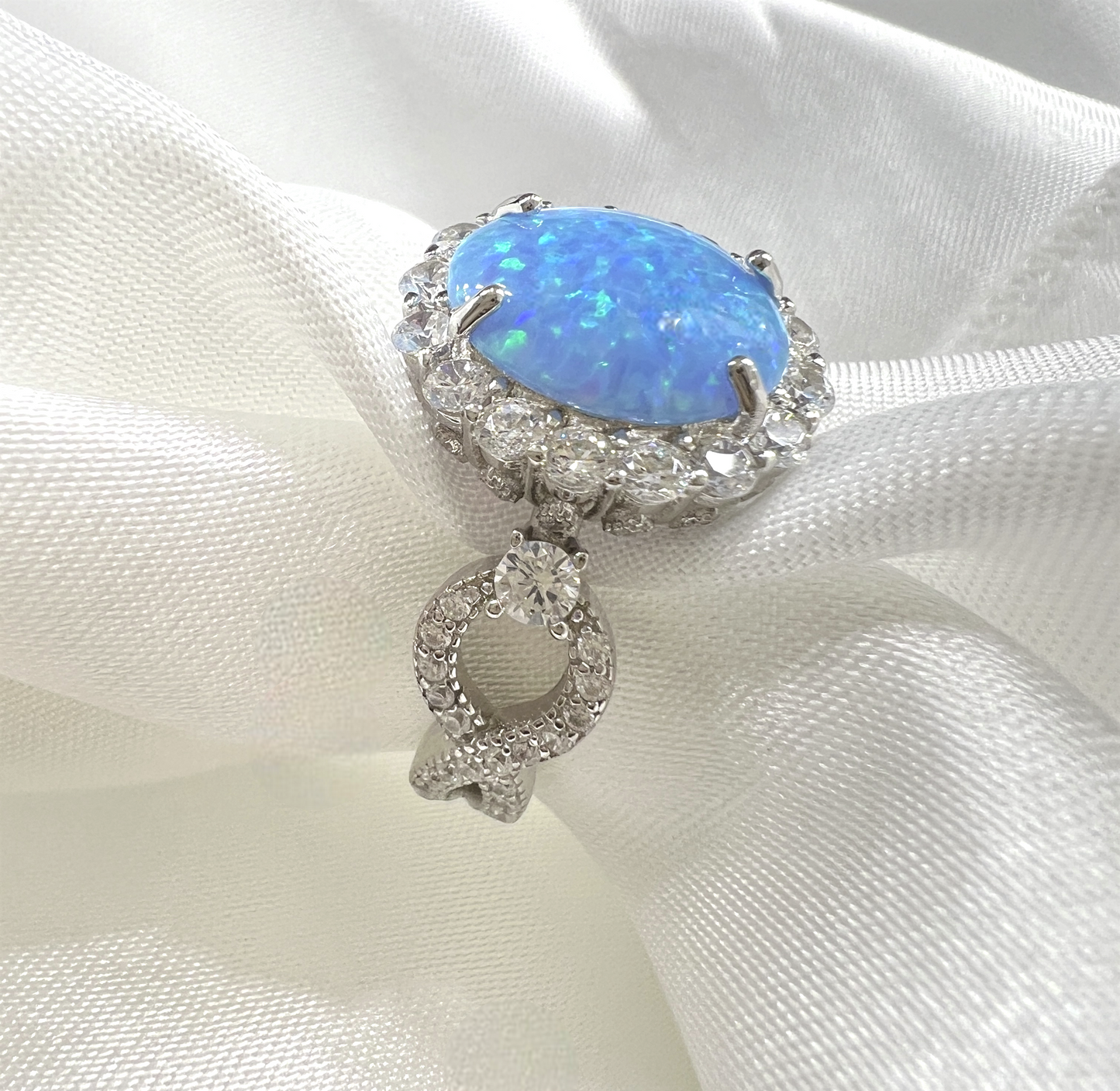 925 Sterling Silver Infinity Oval Cut Lab-Grown Blue Fire Opal & Diamond CZ