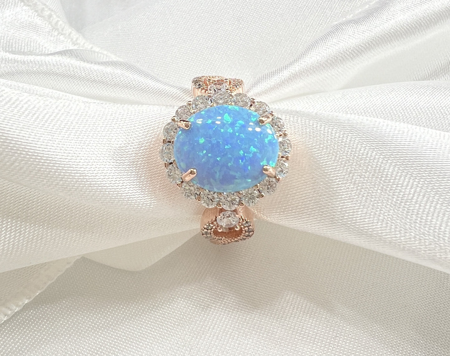 925 Sterling Silver Infinity Oval Cut Lab-Grown Blue Fire Opal & Diamond CZ on Rose gold
